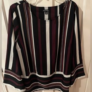 Long sleeve, purple and brown striped blouse.
